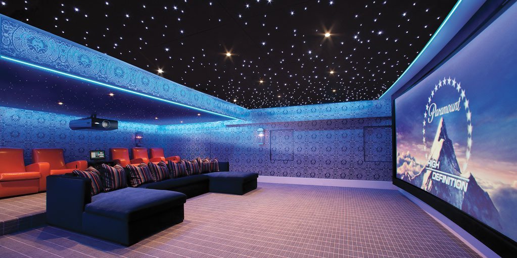 Home cinema with a star-lit ceiling and projection screen